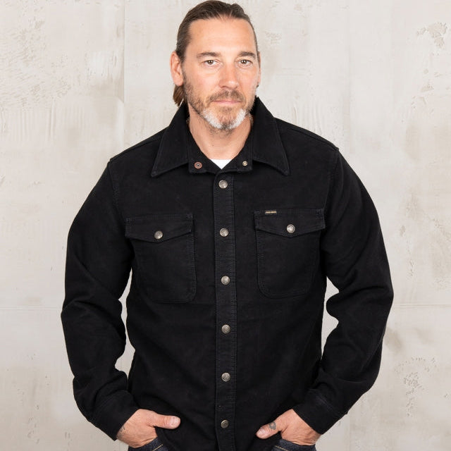 Black workwear shirt on man