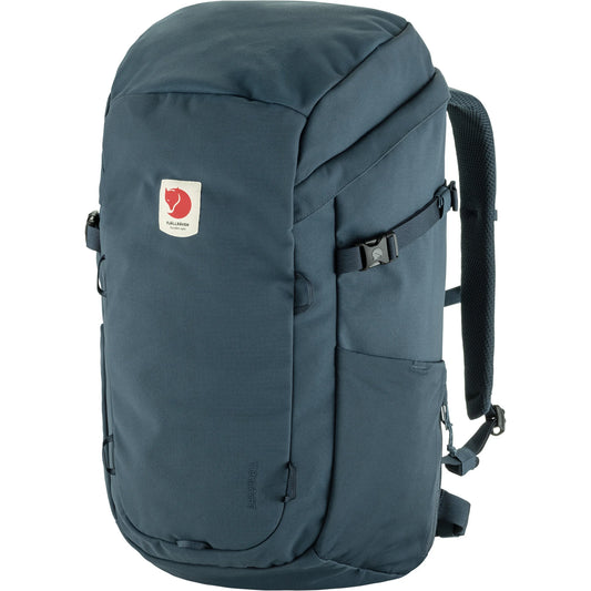 Side view of blue backpack sold at regent 