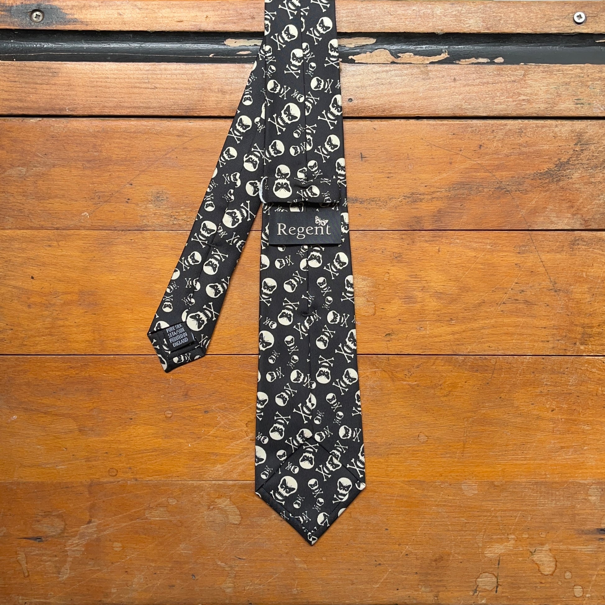 Regent - Woven Silk Tie - Black with Printed Regent Motif - reverse