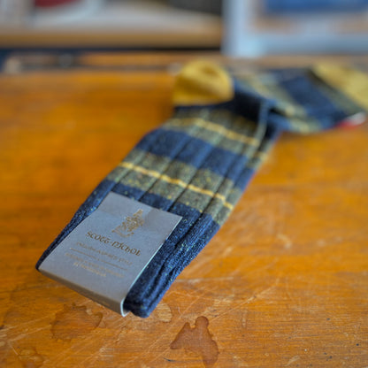 Scott-Nichol socks on a wooden backdrop