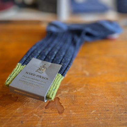 Navy scott-nichol socks on a wooden background