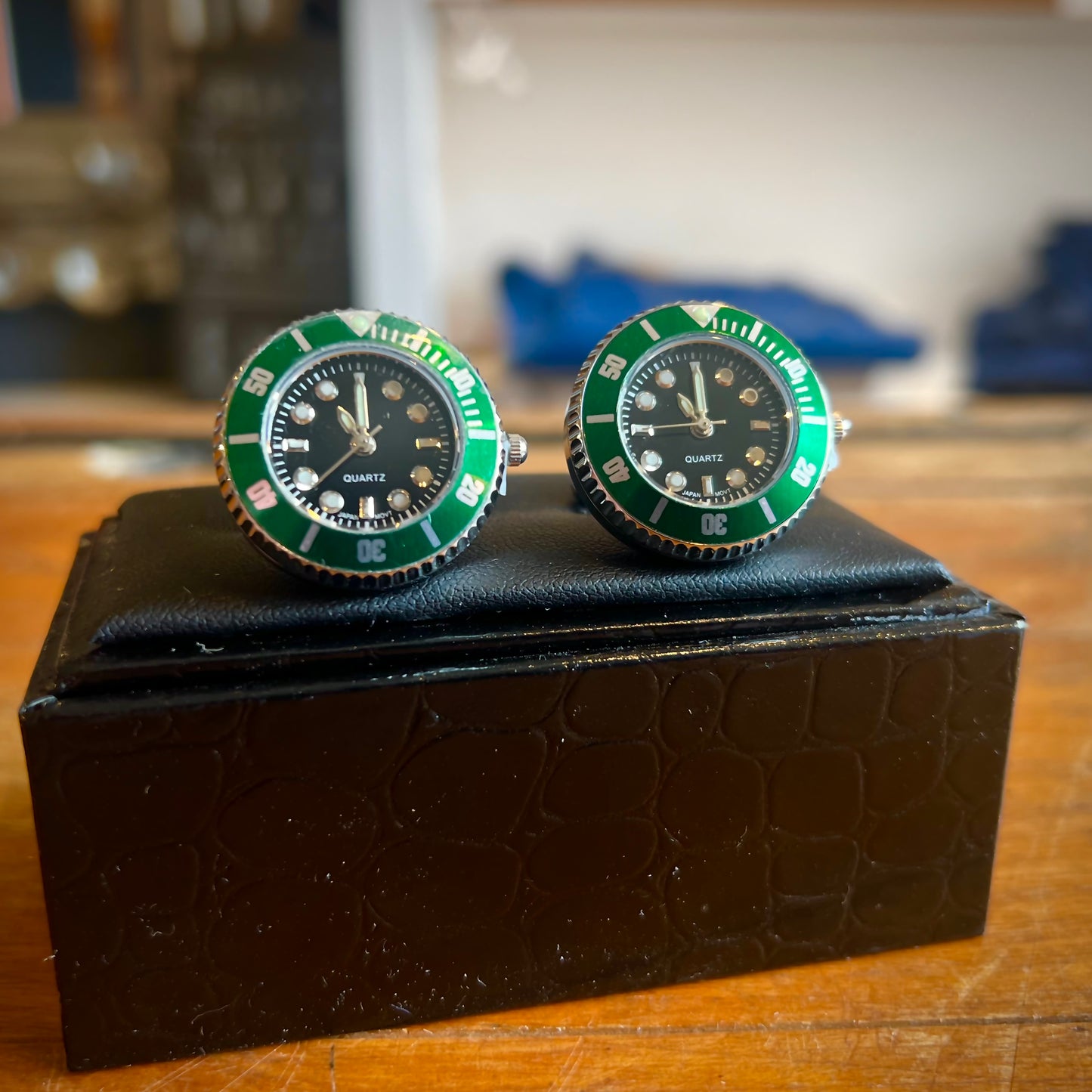 A pair of working watch cufflinks