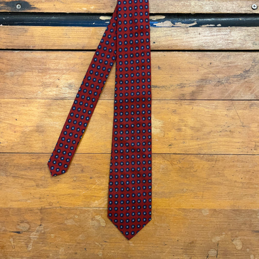 Burgundy cotton tie with blue mandala pattern on boards