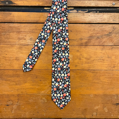 floral cotton tie on wooden boards