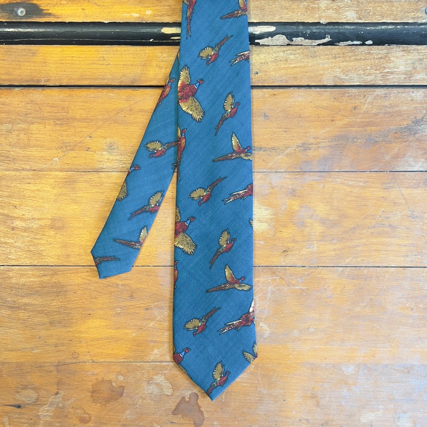 A blue tie with phesants 