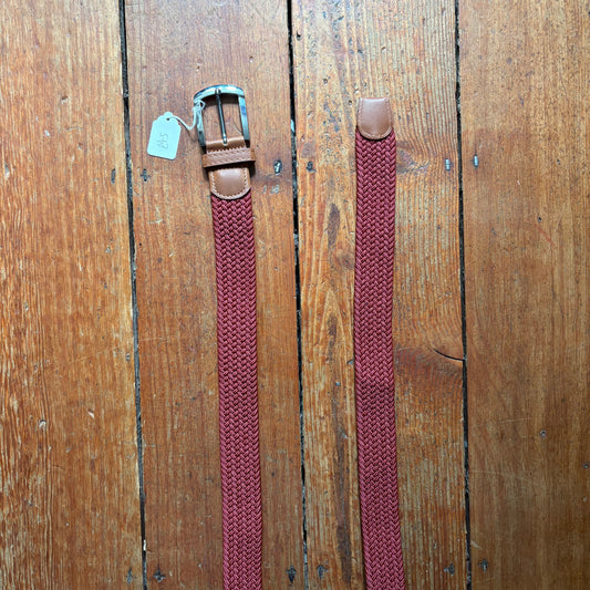 Burgundy belt on wood