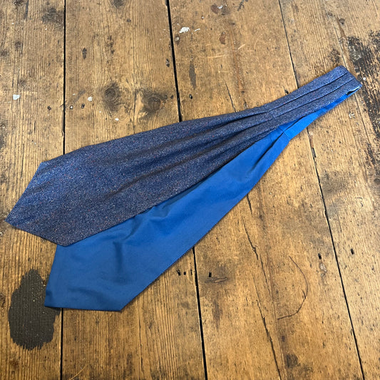 Blue tie on a wooden surface