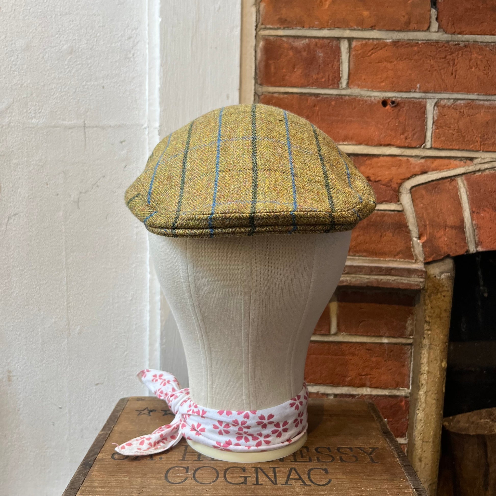 Flat cap made from golden green tweed with blue and dark green overcheck