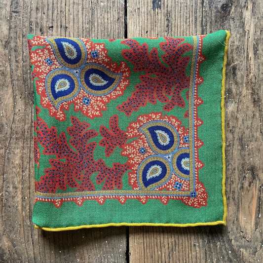 Wool and silk green pocket square with orange paisley pattern
