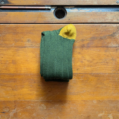 Olive green woollen boot sock with contrasting yellow heel