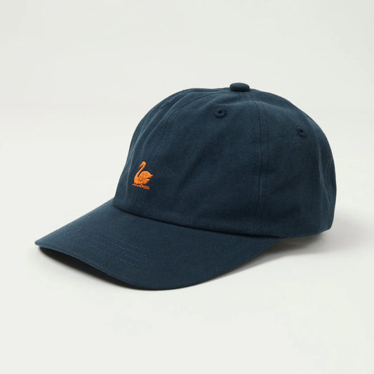 Navy blue cap with orange logo on a light gray background