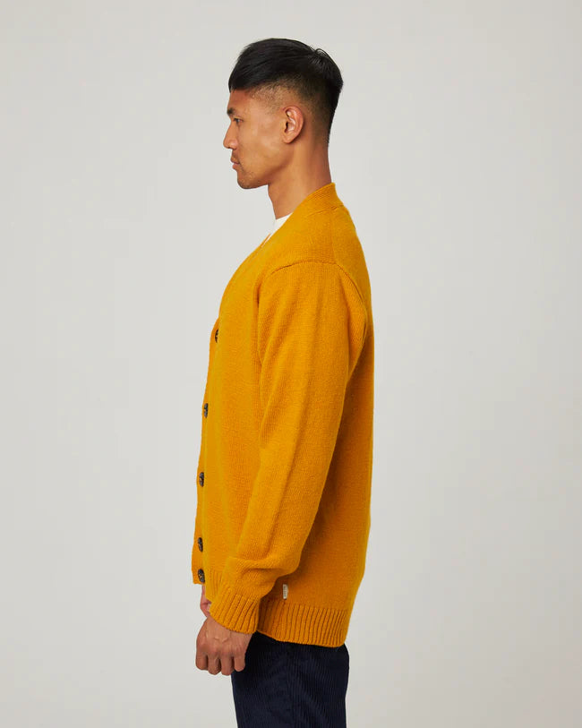 side view of orange cardigan