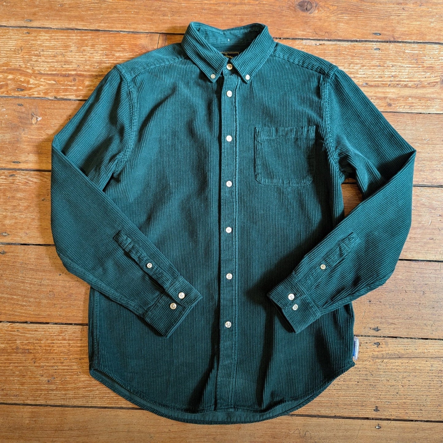 Green whale cord shirt, patch pocket and button down collar.