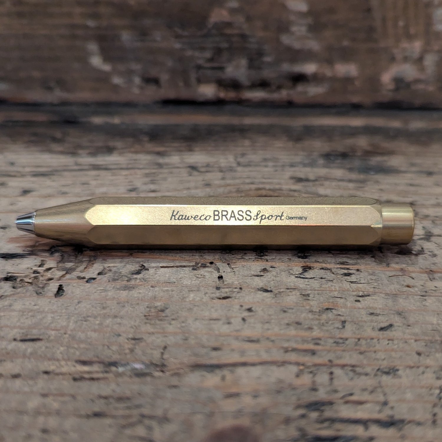 Gold Kaweco Pen on wooden background