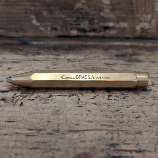 Gold Kaweco Pen on wooden background