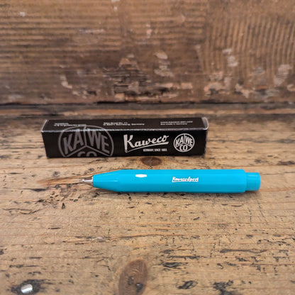 Light Blue Kaweco Pen with black packaging box on wooden background 