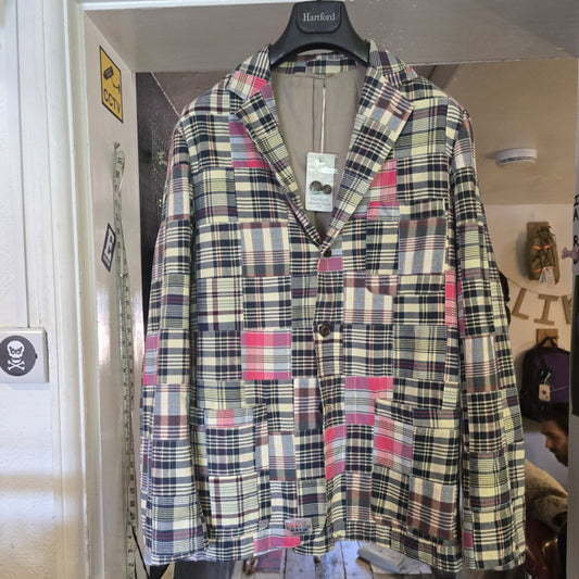 Pink, navy, cream patchwork jacket with 3 buttons and patch pocket on the front.