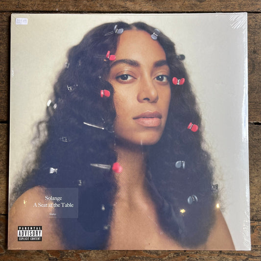 Solange- A seat at the table album on wood background