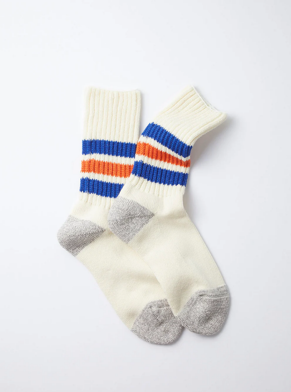 Cream white rototo socks with grey heels and toes and with orange and blue stripes. 