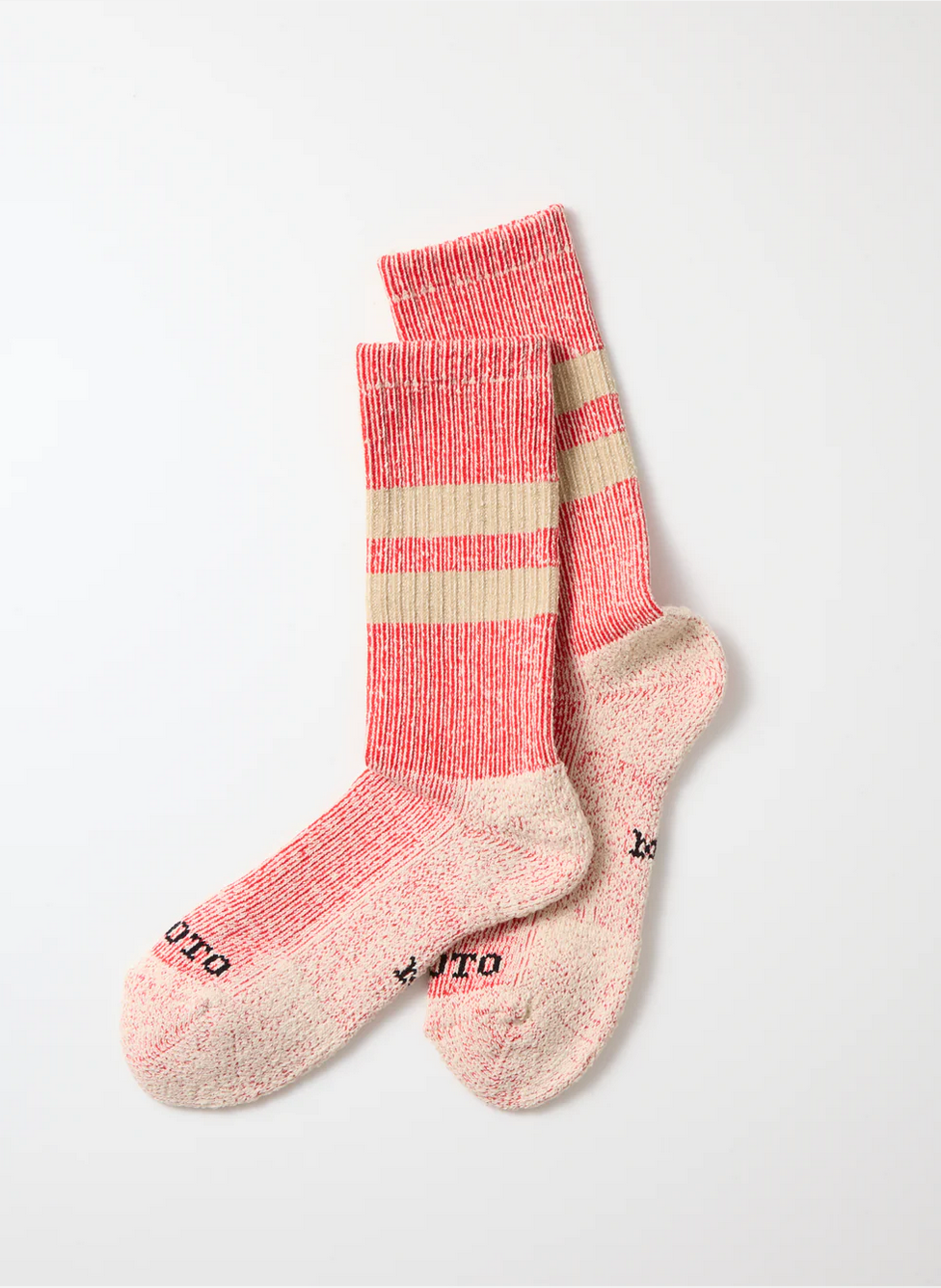 Red and beige rototo socks on a white background