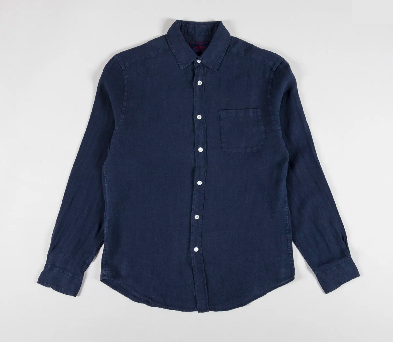 A Navy linen shirt on a white background