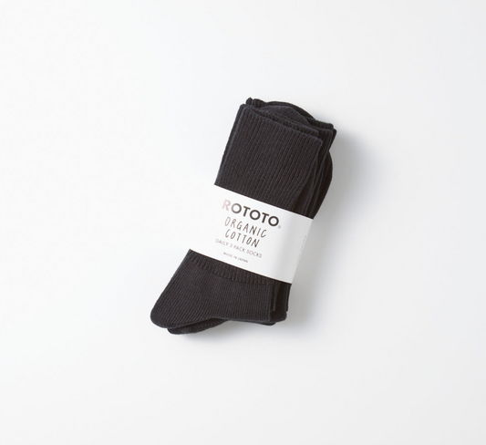 A pack of 3 pairs of black rototo socks on a white background