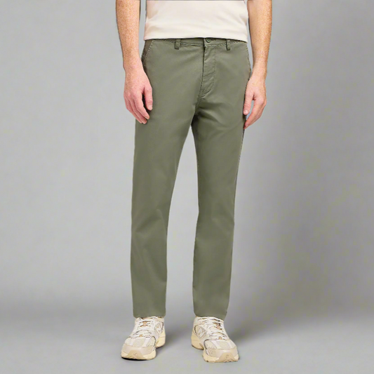 A man wearing green trousers