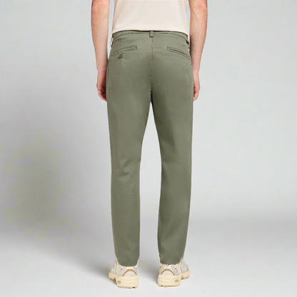 A man wearing green trousers