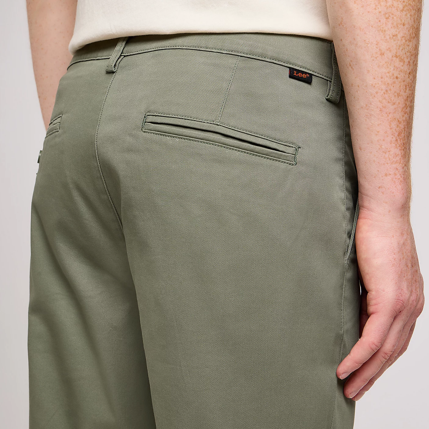 The back pocket of a pair of chinos 