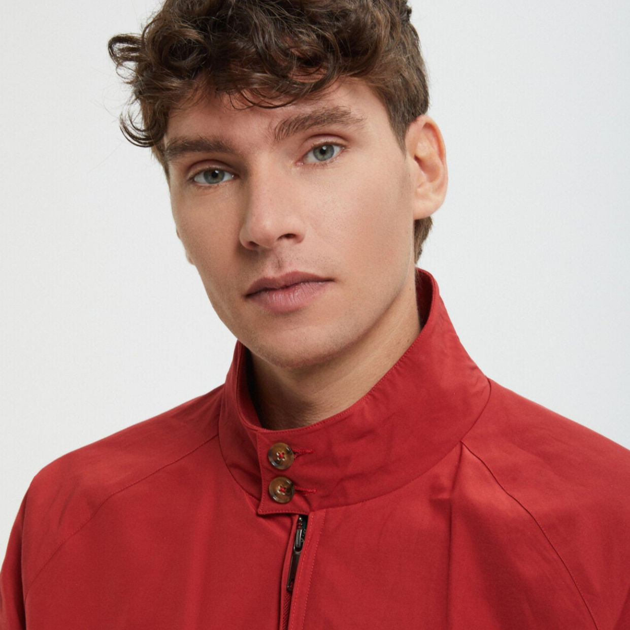 A man wears a red jacket