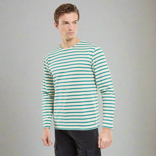 A man wearing a green striped long sleeve shirt