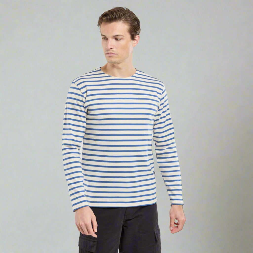 A man wears a marinere shirt with navy stripes