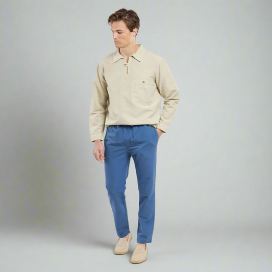 A man wears blue trousers