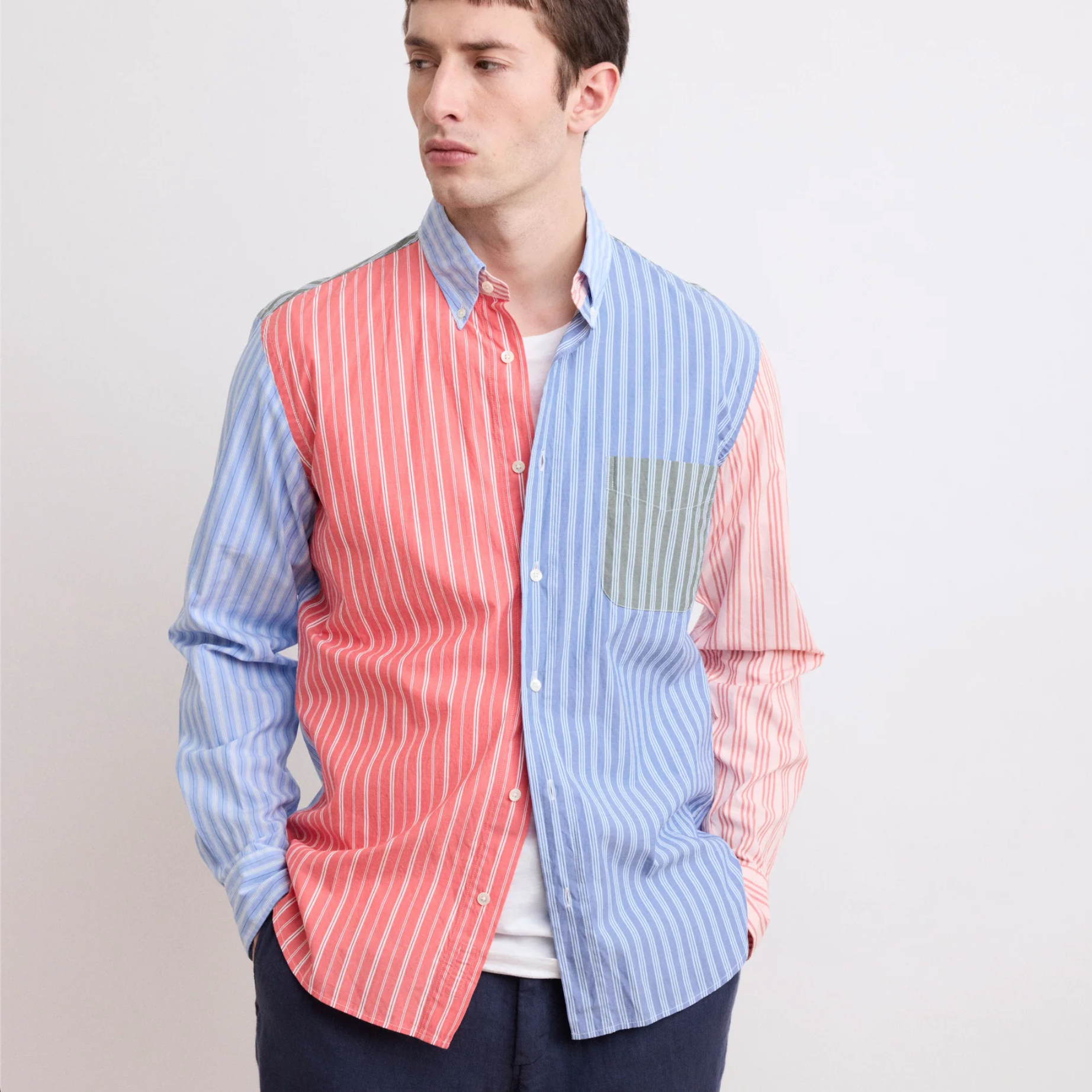 A man wearing a multicoloured shirt