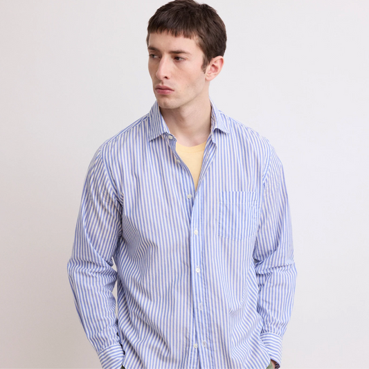 a man wears a blue striped shirt