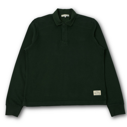 A dark forest green long-sleeve polo rugby shirt with a buttoned collar and ribbed cuffs, laid flat against a white background.