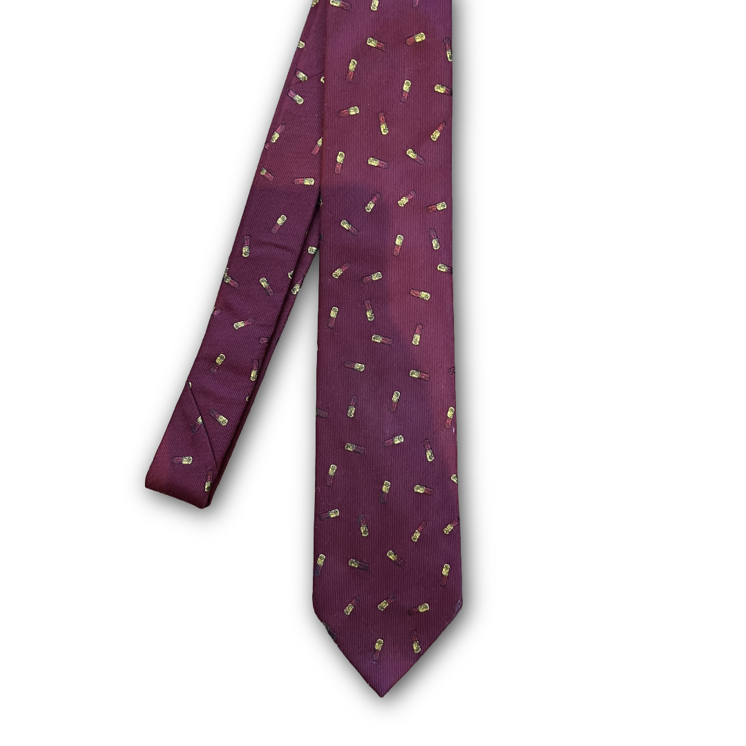Burgundy necktie with a repeating pattern of small shooting shells, displayed against a plain white background.