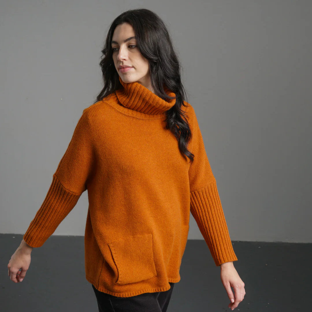 A rust-colored sweater, 100% lambswool, cosy fit - Roll neck, 