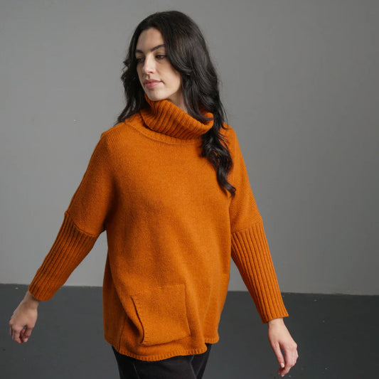 A rust-colored sweater, 100% lambswool, cosy fit - Roll neck, 