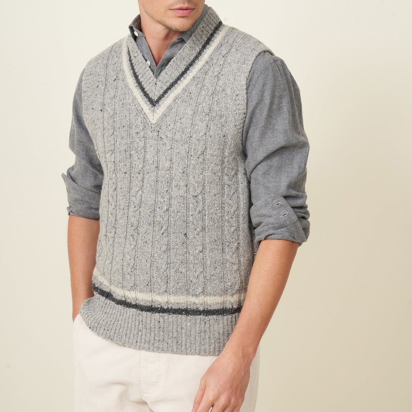 Grey knit, cricket collar style vest.