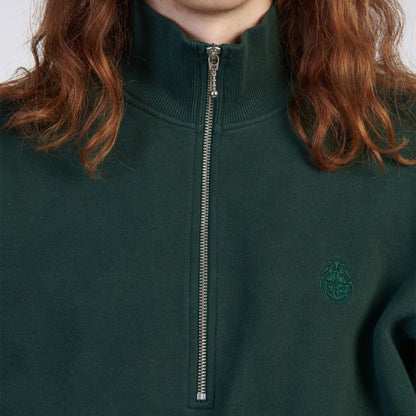 Green half-zip sweatshirt with a logo on a plain background
