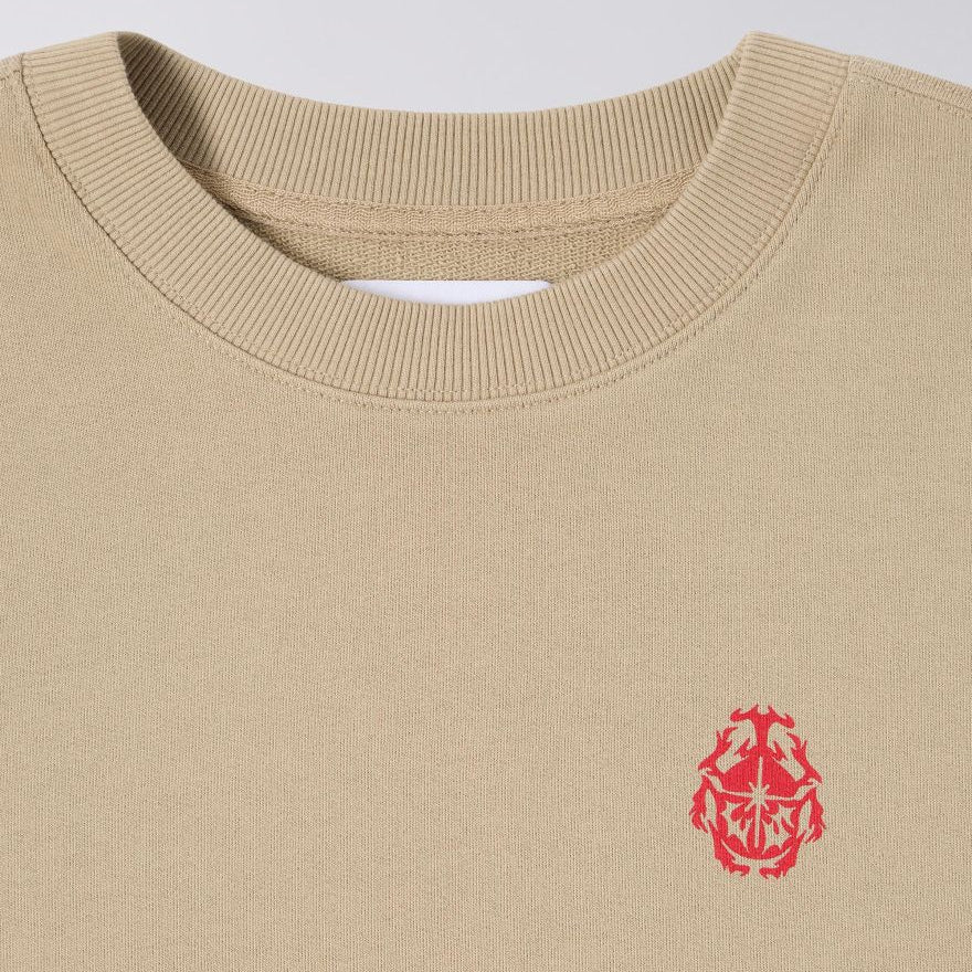 Beige sweatshirt with a red logo on a light gray background