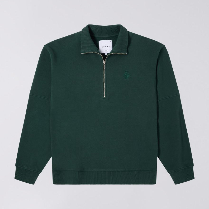 Green pullover with a zipper on a light gray background