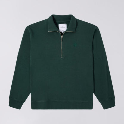 Green pullover with a zipper on a light gray background