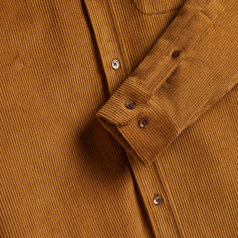 Buttons of burnt orange shirt