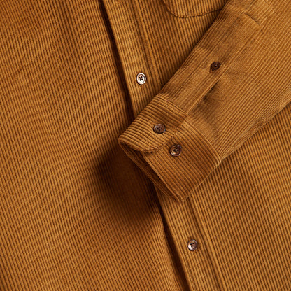 Buttons of burnt orange shirt