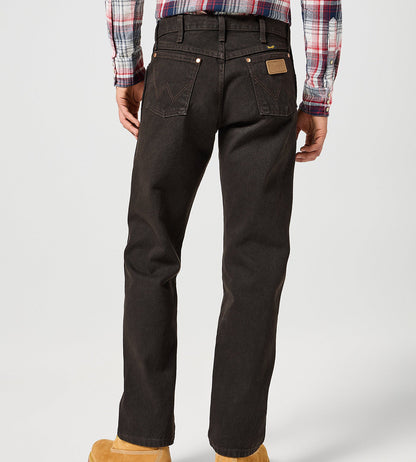 Person wearing black pants, a plaid shirt, and tan boots on a white background