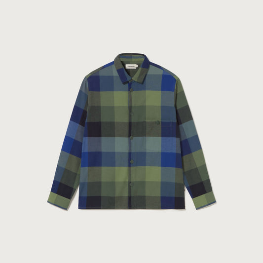 Plaid shirt with green and blue pattern on a light gray background
