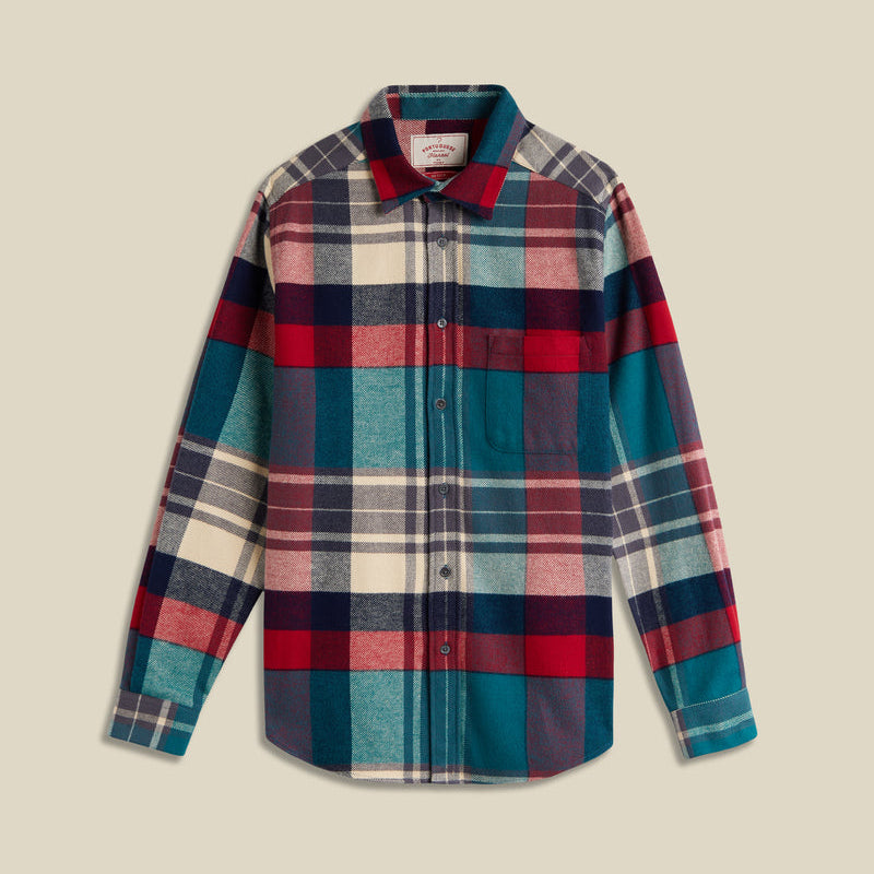 Plaid shirt with red, blue, and beige colors on a beige background