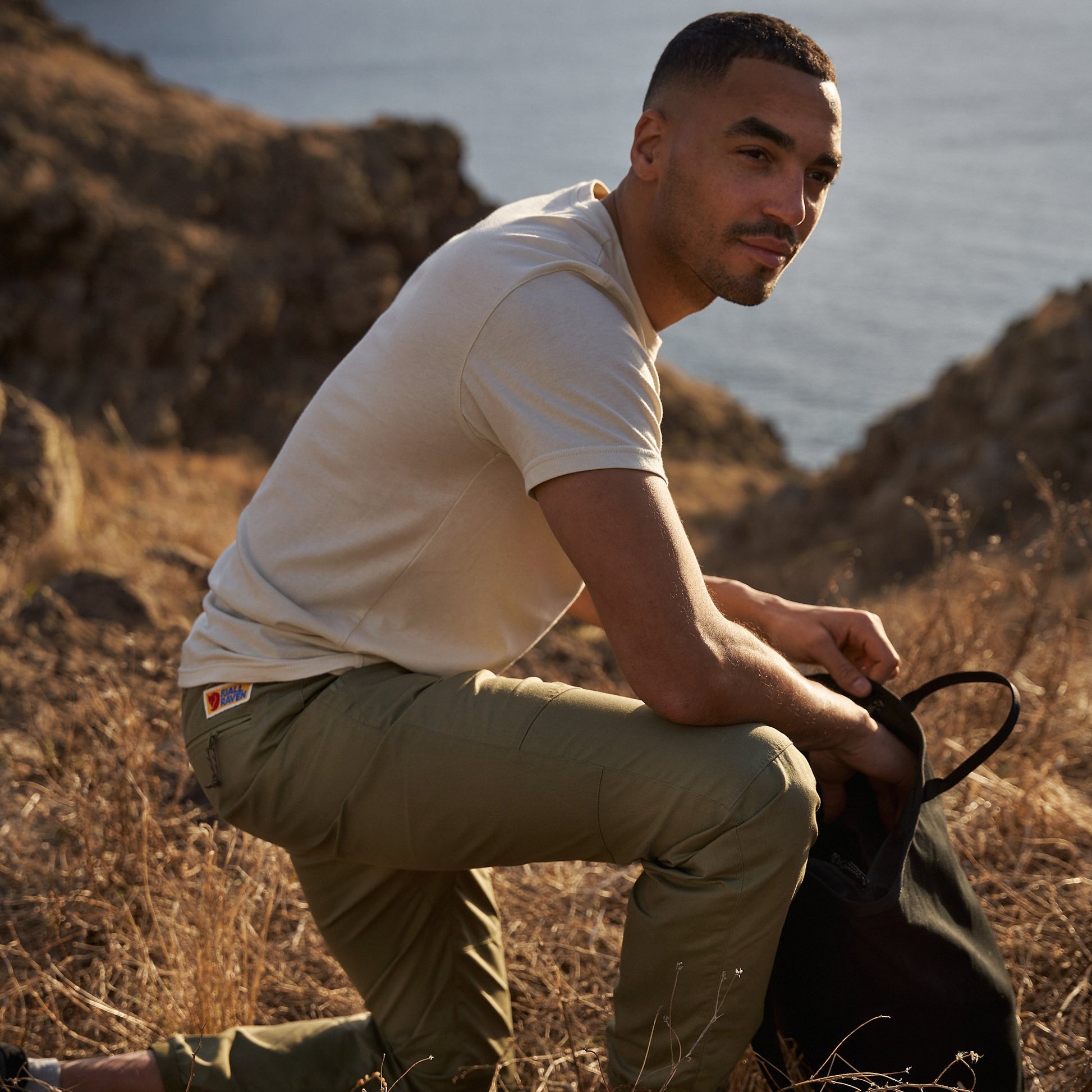 man wearing fjallraven green trousers